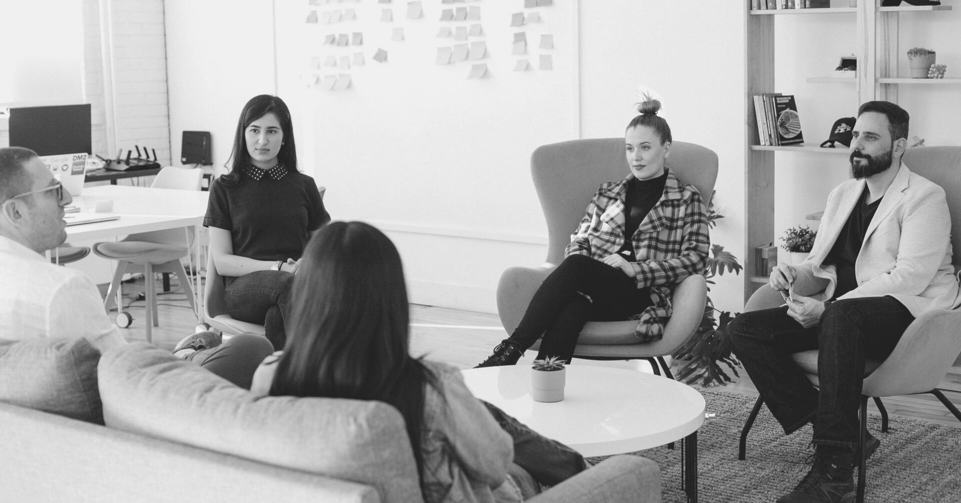 A business group meeting in someone's office.