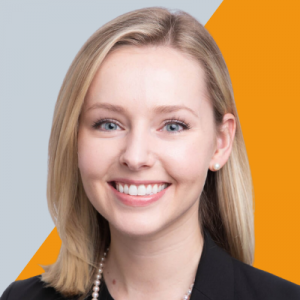 Headshot of a professional woman smiling for camera.